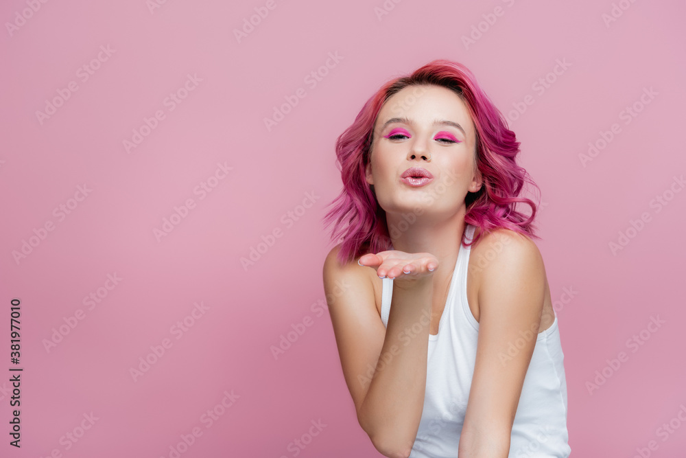 young woman with colorful hair blowing kiss isolated on pink young woman with colorful hair blowing kiss isolated on pink