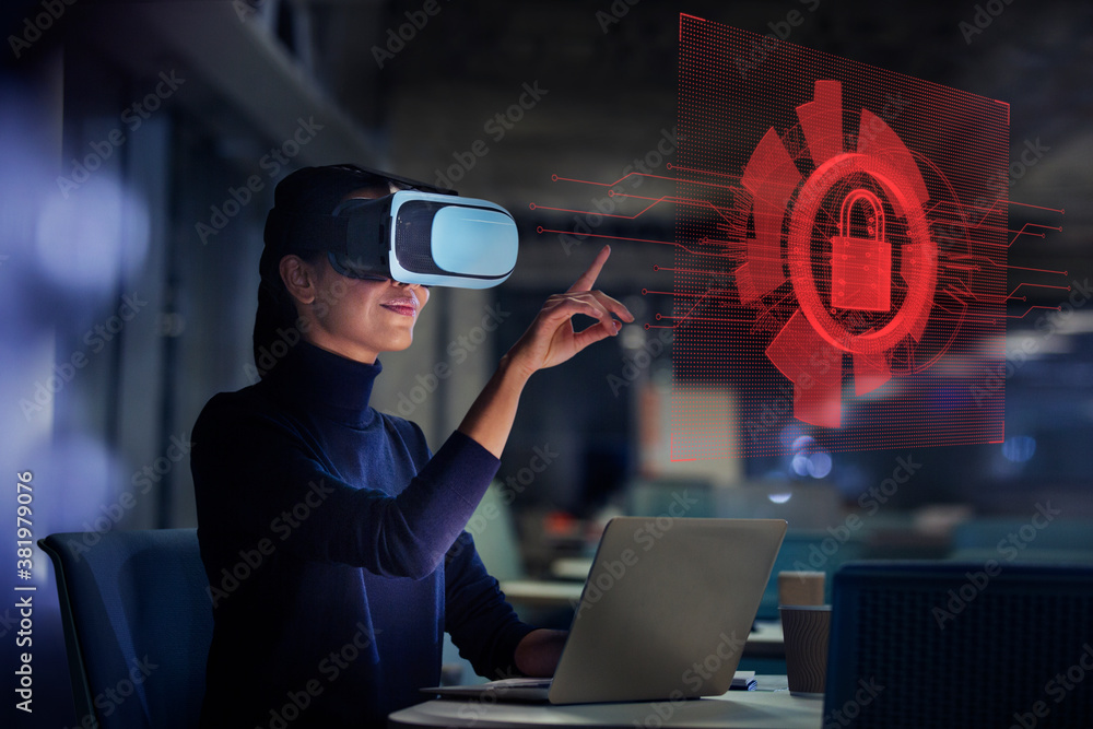 © Robert Daly/Caia Image - Businesswoman with virtual reality glasses looking at virtual screen