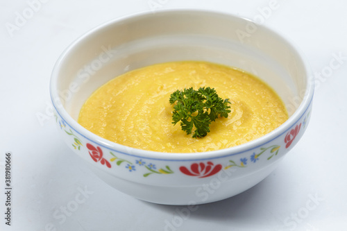 pumpkin cream soup isolated on white
