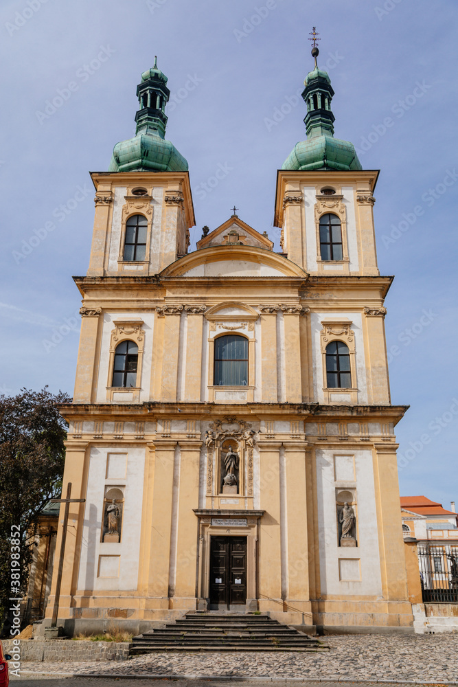 Church of the Annunciation in the main Republic square of Duchcov in sunny day, Northern Bohemia, Czech Republic