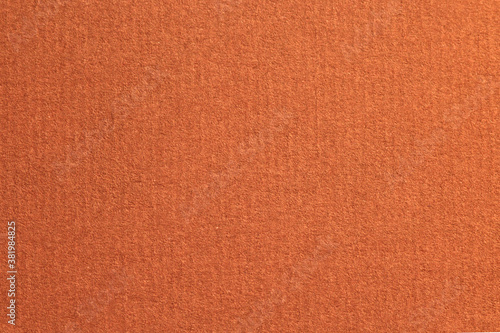 Red laid textured paper cardboard background close up