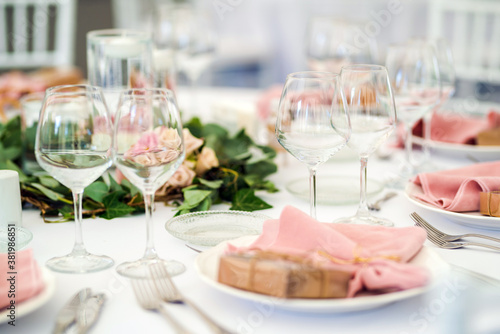 Luxury wedding table decoration in pink and white. Special event table set up. Fresh flower decoration.