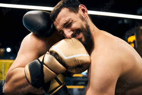 Принти на полотні Professional athlete hurting after receiving a strike in the teeth
