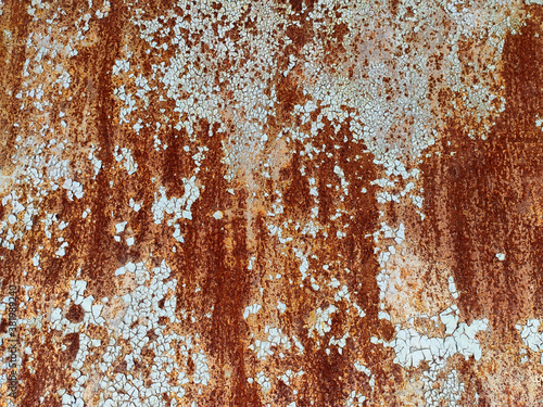 Corroded metal background. Rusty metal background with streaks of rust. Rust stains. Rystycorrosion.