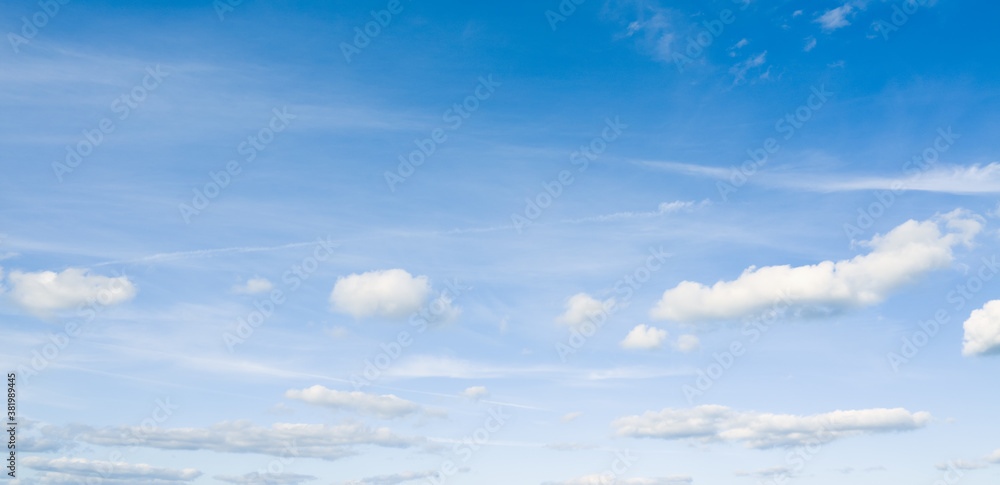 Panoramic photo of beautiful light blue sky and white clouds.