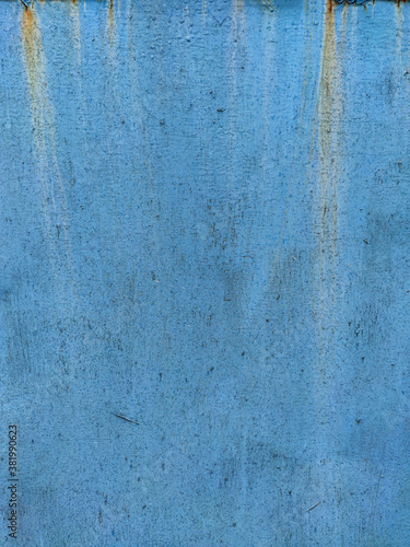 Rusty metal panel with cracked blue paint, corroded grunge metal background