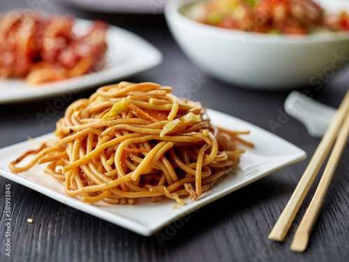 plate of fried noodles with vegetables photo