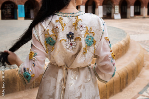 Moroccan traditional dress, embroidery on the caftan. Festive women's clothing in Morocco photo