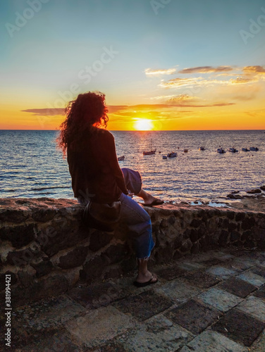 S'Archittu (Italy) - The little arch, in the Sardinian language, is a small coastal touristic town in province of Oristano, Sardinia region and island. Here a view at sunset.