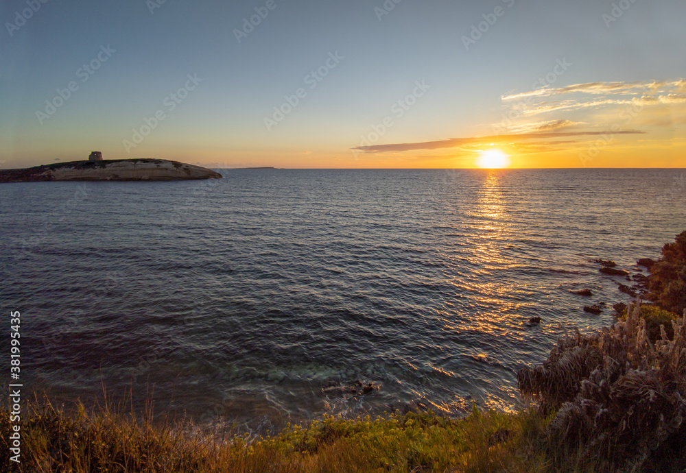 Obraz premium S'Archittu (Italy) - The little arch, in the Sardinian language, is a small coastal touristic town in province of Oristano, Sardinia region and island. Here a view at sunset.