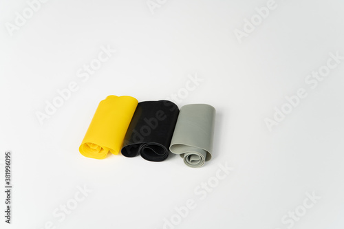 Black, Grey and Yellow Weight Bands, for Fitness Training in Gym.