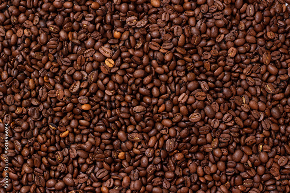 Grains coffee. Background from coffee beans. Roasted coffee beans. Brown coffee beans in whole background. Grains coffee. Background from coffee beans. Roasted coffee beans. Brown coffee beans in whole background.