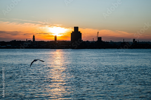 Liverpool, UK. Beautiful colorful long exposure shot of river Mersey from Albert Dock with smooth reflections of night lights from the other side of a shore. 
