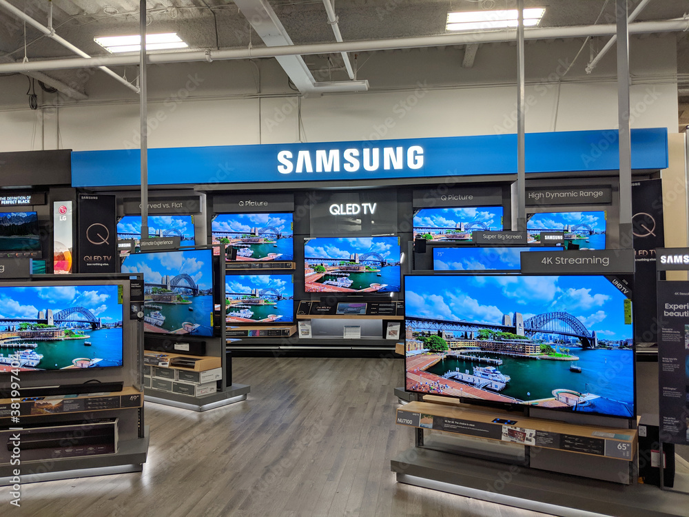 Samsung Logo and QLED TV inside Best Buy Store foto de Stock | Adobe Stock