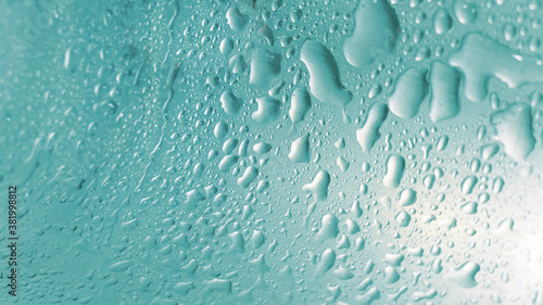 grain aqua color water drops on glass background texture or wallpaper
