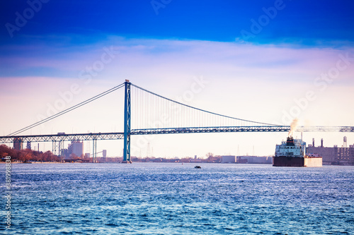 Ambassador Bridge view from Detroit, MI USA to Windsor Ontario Canada and freight boat