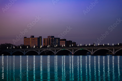 Night view of MacArthur bridge over Detroit river on sunny day from sunset point of Belle Isle