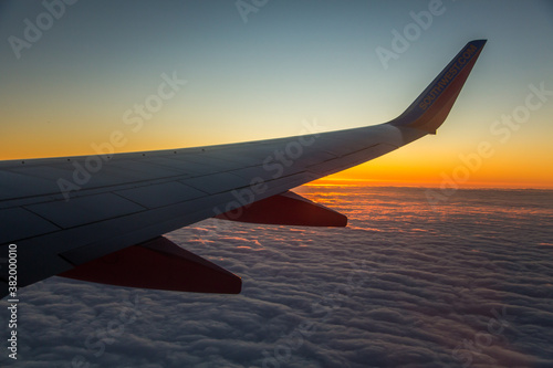 Wing of a commercial airline aircraft at sunsise