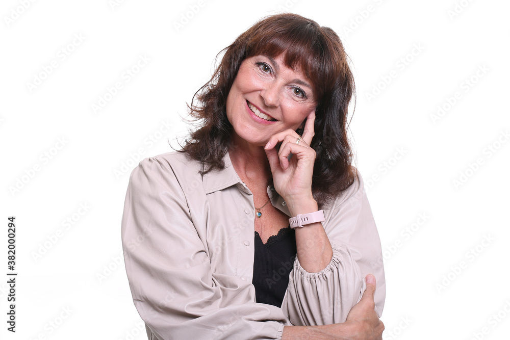Beautiful mature woman in front of a background Beautiful mature woman in front of a background