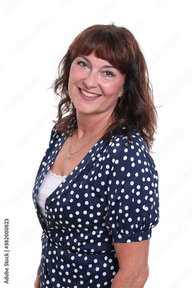 Beautiful mature woman in front of a background Beautiful mature woman in front of a background