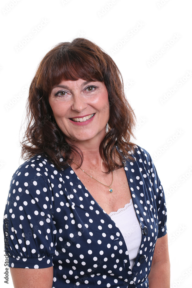 Beautiful mature woman in front of a background Beautiful mature woman in front of a background