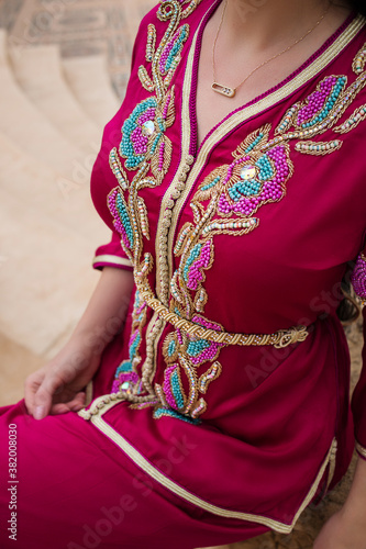 Moroccan traditional dress, embroidery on the caftan. Festive women's clothing in Morocco