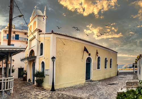 The Agios Antonios Orthodox Church located next to the port in Spetses Island, Greece. photo
