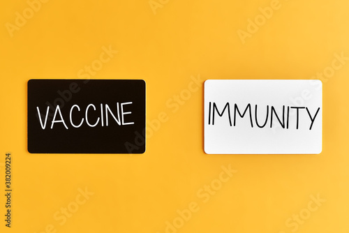 immunity vaccine. immunity vaccine cards on orange background