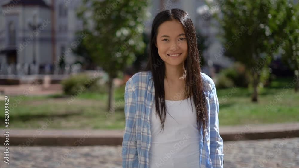 middle shot. portrait of cute beautiful young asian woman.female student cute smiling. middle shot. portrait of cute beautiful young asian woman.female student cute smiling.