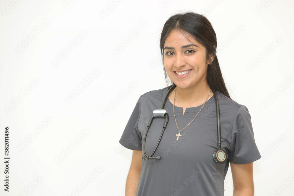 Portrait of an attractive hispanic female healthcare professional. Woman nurse on white background with copy space. Portrait of an attractive hispanic female healthcare professional. Woman nurse on white background with copy space.
