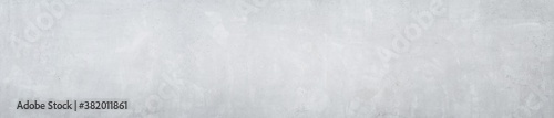 Panorama of a smooth gray concrete or cement wall as wallpaper or texture