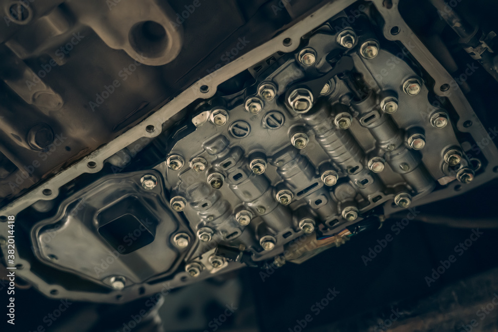 CVT gearbox, new modern Variator automatic transmission in process of changing oil and maintenance, close up. CVT gearbox, new modern Variator automatic transmission in process of changing oil and maintenance, close up.