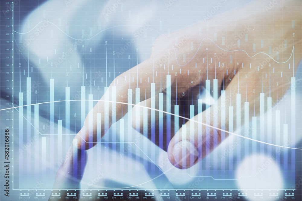 Multi exposure of man's hands holding and using a phone and financial chart drawing. Market analysis concept. Multi exposure of man's hands holding and using a phone and financial chart drawing. Market analysis concept.