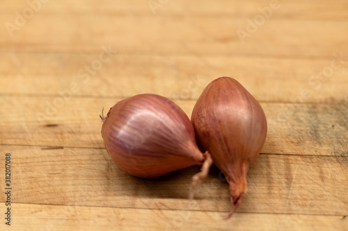 Shallot on wooden background