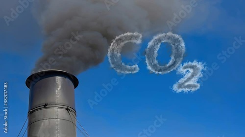Dark smoke emanating from a black metal chimney with the symbol CO2 on the screen to symbolize the climate change emissions