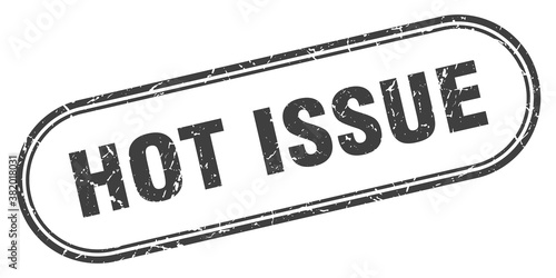 hot issue stamp. rounded grunge textured sign. Label