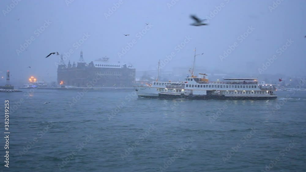 Winter in Istanbul. Haydarpasa Station Building and a passenger ship heading to European Side. A beautiful snowy night
Winter in Istanbul. Haydarpasa Station Building and a passenger ship heading to European Side. A beautiful snowy night