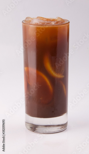 A fresh cold cocktail with coffee and orange slices