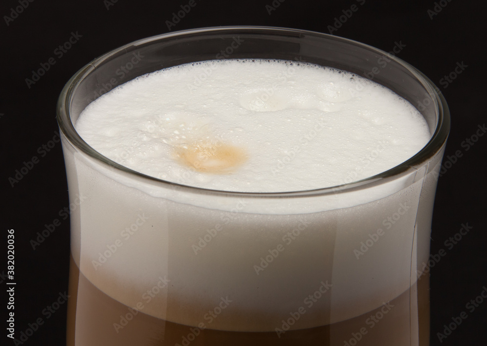 milk foam on a coffee, close up milk foam on a coffee, close up