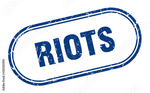 riots stamp. rounded grunge textured sign. Label