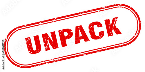 unpack stamp. rounded grunge textured sign. Label