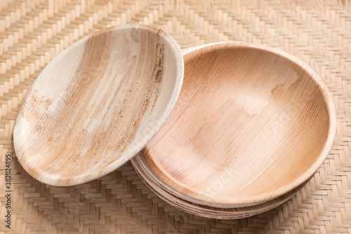 Betel palm leaf plate (Biodegradable plate, Compostable plate or Eco friendly disposable plate) on woven bamboo sheet