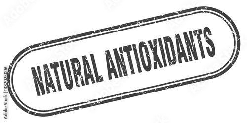natural antioxidants stamp. rounded grunge textured sign. Label