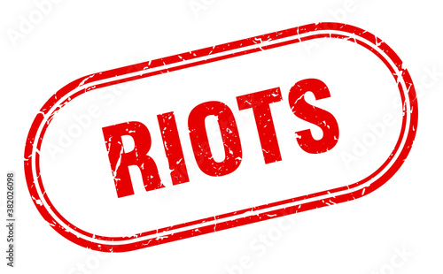 riots stamp. rounded grunge textured sign. Label