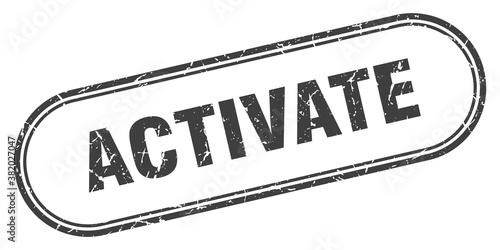 activate stamp. rounded grunge textured sign. Label