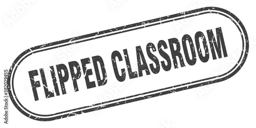 flipped classroom stamp. rounded grunge textured sign. Label