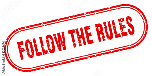follow the rules stamp. rounded grunge textured sign. Label