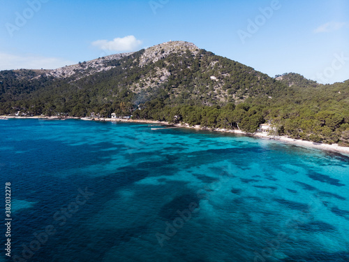 Aerial drone view, beautiful scenic landscape view of mountains and blue crystal clear water on the shore of Mallorca Island, Balearic Island, Spain