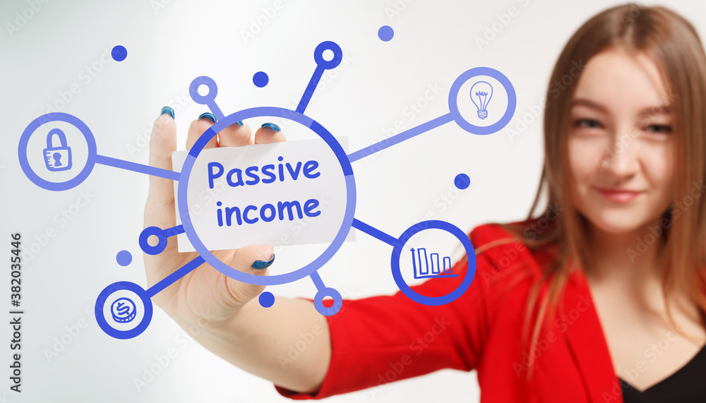 Business, Technology, Internet and network concept. Young businessman working on a virtual screen of the future and sees the inscription: Passive income Business, Technology, Internet and network concept. Young businessman working on a virtual screen of the future and sees the inscription: Passive income
