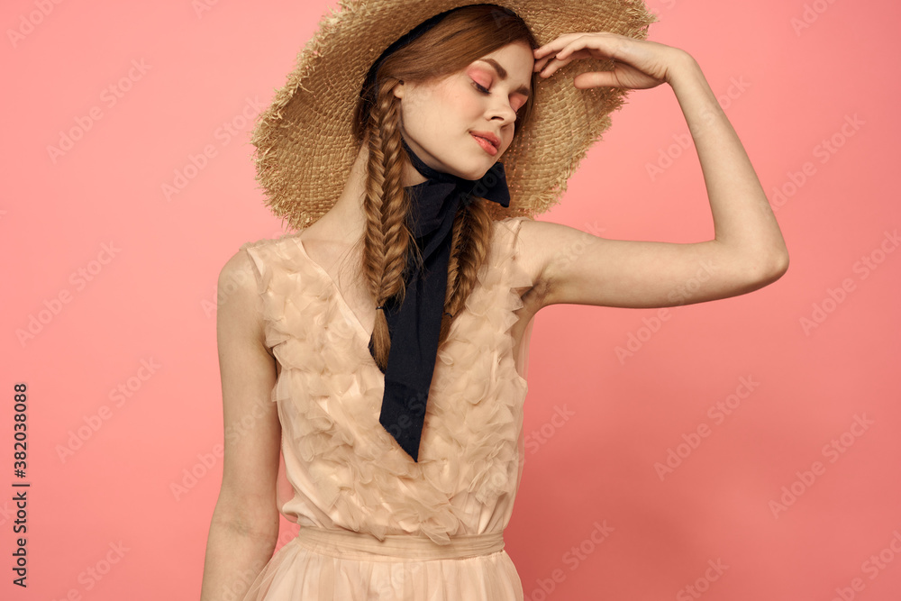 Beautiful woman in hat and in black dress ribbon portrait pink background model Beautiful woman in hat and in black dress ribbon portrait pink background model